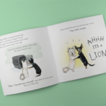 square-booklet-mockup-open-lying-on-a-solid-surface-a15088